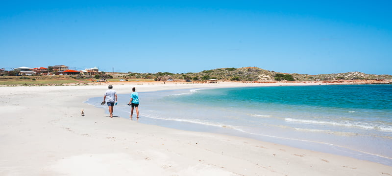 Couple walking along the Kalbarri shoreline