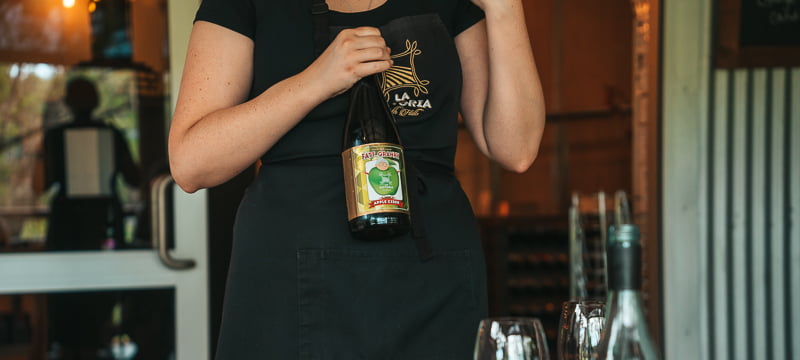Waitress explaining the La Fattoria beverages